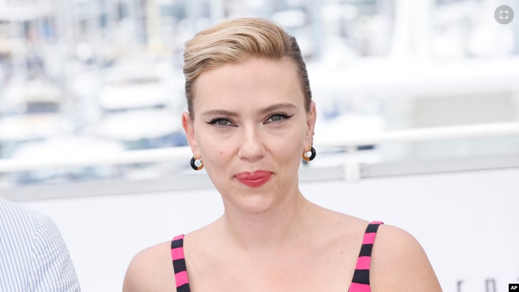 FILE - Scarlett Johansson poses for photographers at the 76th Cannes Film Festival, in southern France, May 24, 2023. OpenAI halted the use of one of its ChatGPT voices after some drew similarities to Johansson in the film “Her.” (Photo by Joel C Ryan/Invision/AP, File)