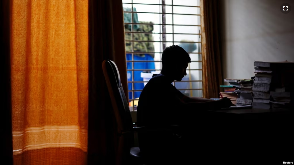 Sheikh Tamim Hasan, 13, a student of class seven, studies in his room as authorities decided to close schools during countrywide heatwave in Dhaka, Bangladesh, April 30, 2024. (REUTERS/Mohammad Ponir Hossain)