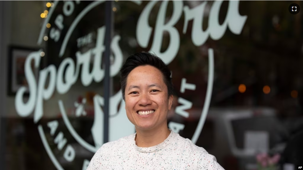 The Sports Bra founder and CEO Jenny Nguyen poses for a photo at the sports bar on Thursday, April 25, 2024, in Portland, Ore. (AP Photo/Jenny Kane)