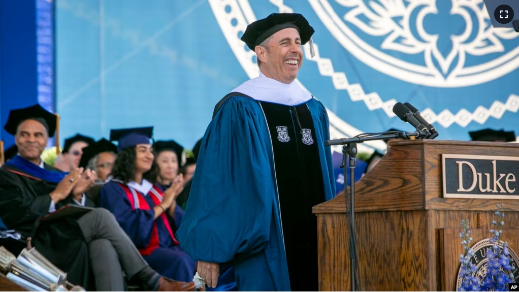 In this photo provided by Duke University, commencement speaker Jerry Seinfeld laughs on stage during the school's graduation ceremony, Sunday, May 12, 2024, in Durham, N.C. (Jared Lazarus/Duke University via AP)