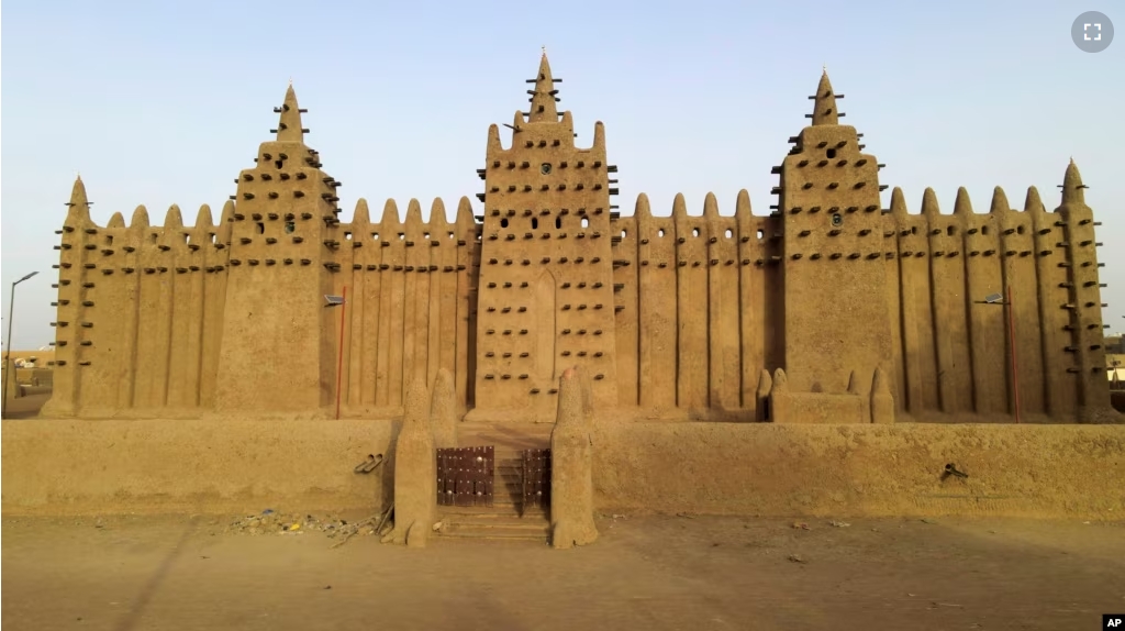 The world's largest mud-brick building, the Great Mosque of Djenne, Mali, awaits its annual replastering, Friday, May 10, 2024. (AP Photo/Moustapha Diallo, File)