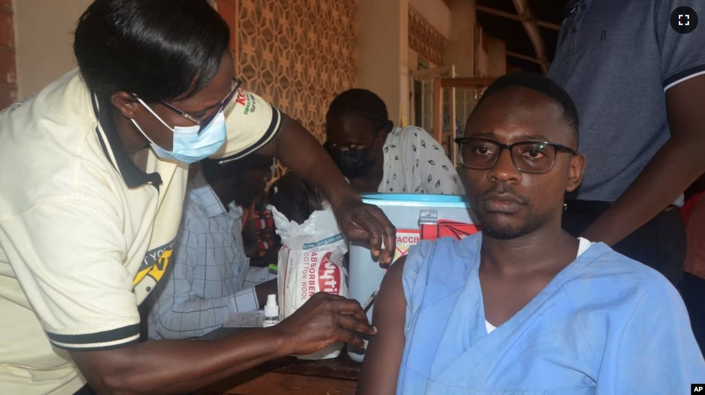 A man receives a shot of yellow fever vaccine at Kiswa Health Center III in Kampala, Uganda Tuesday, April. 2, 2024. (AP Photo)