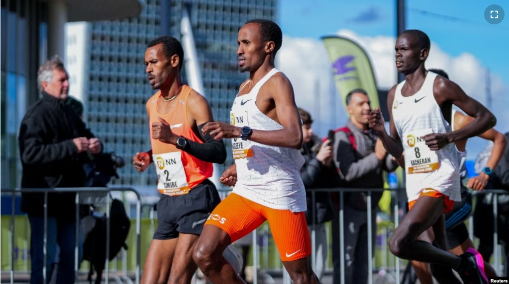 FILE - Dutch runner Abdi Nageeye wears a CGM (continuous glucose monitor) on his upper left arm as he competes in the 2022 Rotterdam marathon, in Rotterdam, Netherlands, April 2022. (NN Running Team/Handout via REUTERS)