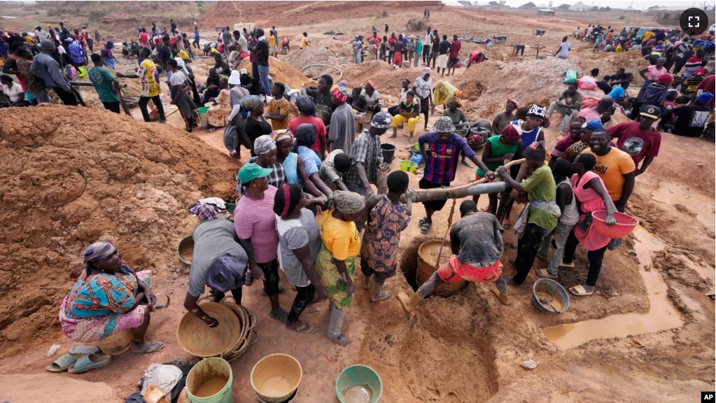 Miners work at an illegal tin mining site in Jos, Nigeria, Wednesday, April 3, 2024. (AP Photo/Sunday Alamba)