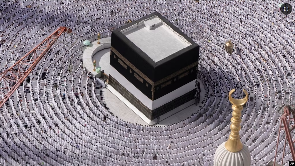 FILE - Muslim pilgrims pray around the Kaaba, the cubic building at the Grand Mosque, during the annual Hajj pilgrimage in Mecca, Saudi Arabia, on June 25, 2023. (AP Photo/Amr Nabil, File)
