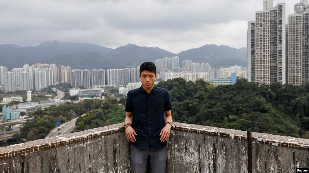 FILE - Pro-democracy activist Owen Chow reacts during an interview in Hong Kong, China February 8, 2021. (REUTERS/Tyrone Siu)