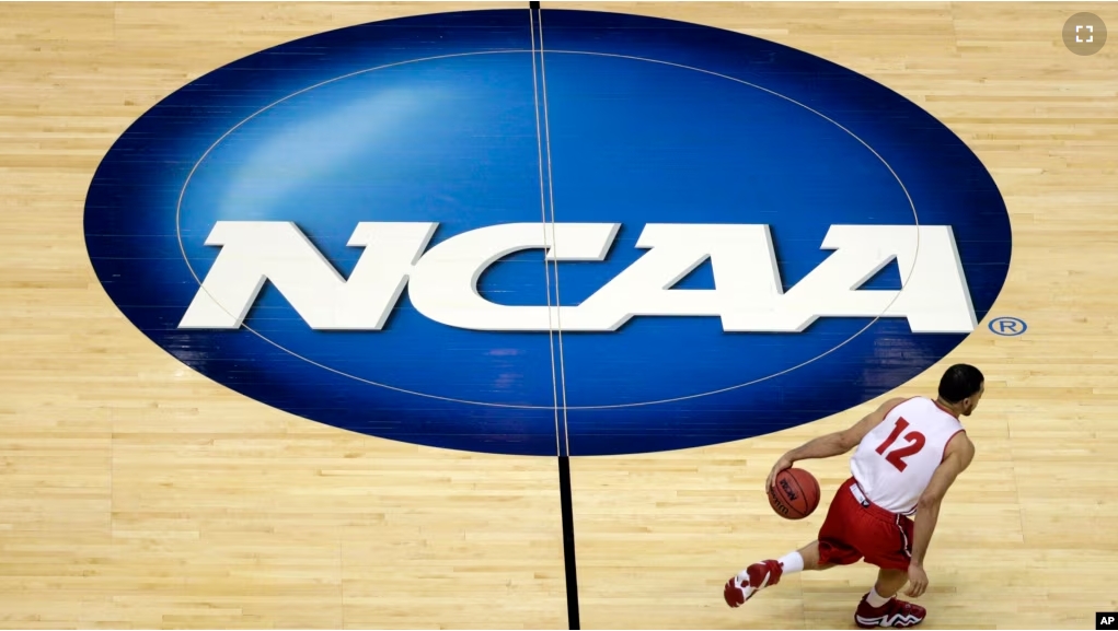 FILE - Wisconsin's Traevon Jackson dribbles past the NCAA logo during practice at the NCAA men's college basketball tournament March 26, 2014, in Anaheim, Calif. (AP Photo/Jae C. Hong, File)