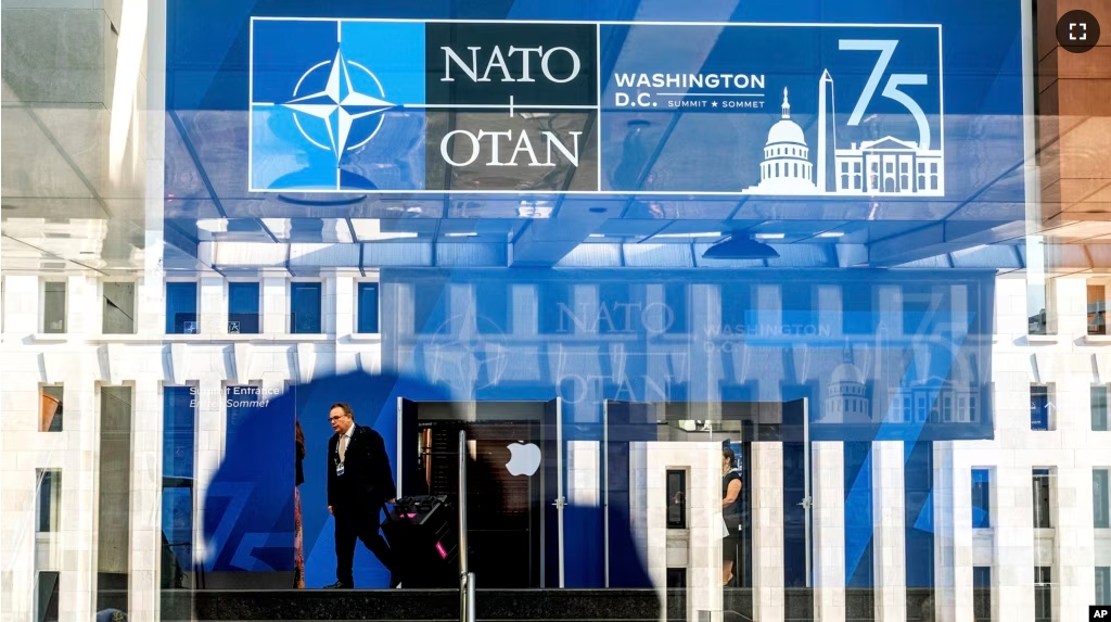 A NATO summit attendee walks through the Walter E. Washington Convention Center in Washington, on Tuesday, July 9, 2024. (AP Photo/Noah Berger)