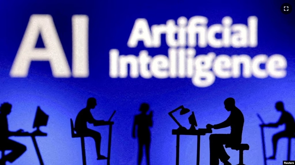 FILE - Figurines with computers and smartphones are seen in front of the words "Artificial Intelligence AI" in this illustration taken, February 19, 2024. (REUTERS/Dado Ruvic/Illustration/File Photo)