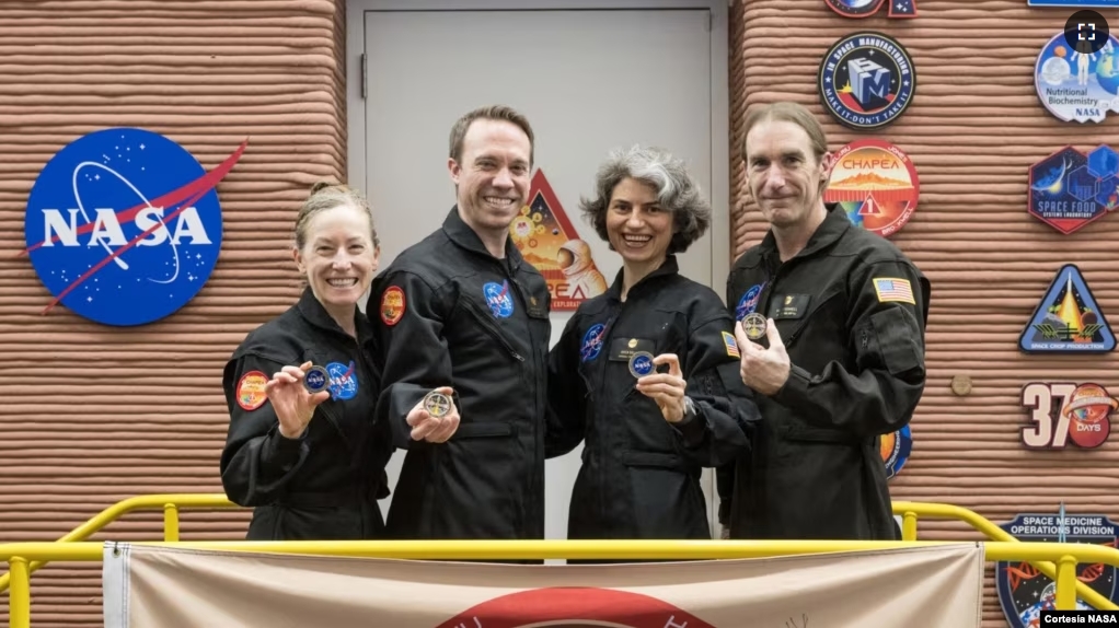 This image shows the CHAPEA leaving the Mars habitat mission July 6, 2024, at NASA’s Johnson Space Center in Houston. From left: Kelly Haston, Nathan Jones, Anca Selariu, and Ross Brockwell. (NASA/Josh Valcarcel)