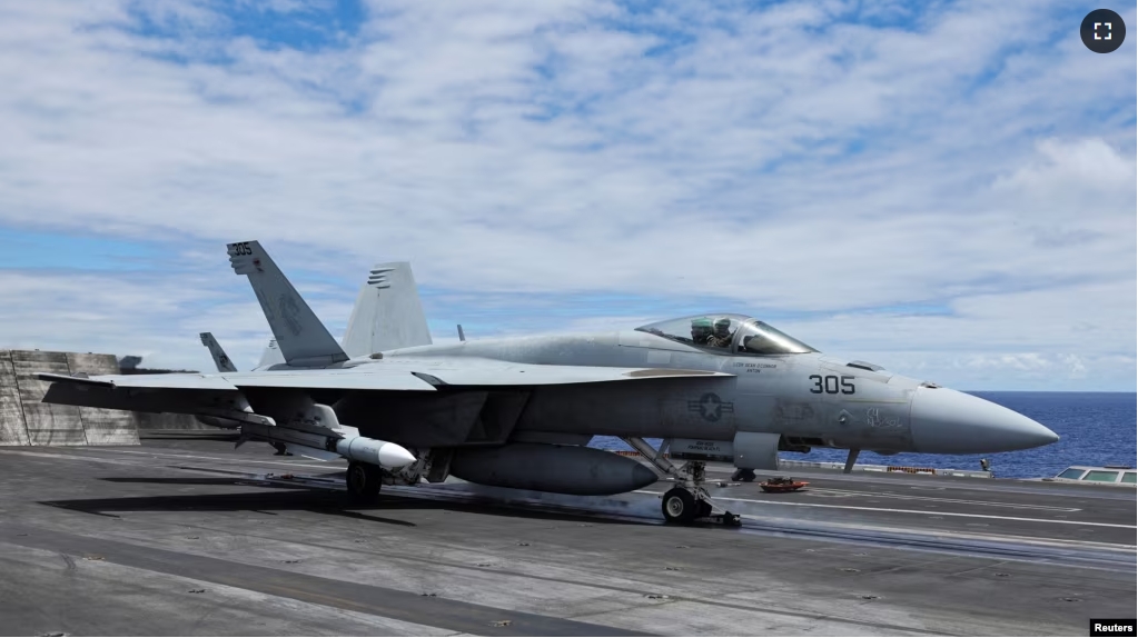 FILE - A F-18 jet launches off the USS Carl Vinson aircraft carrier during the Rim of the Pacific (RIMPAC) military exercises about 100 miles south of Oahu, Hawaii, U.S. July 19, 2024. (REUTERS/Marco Garcia)