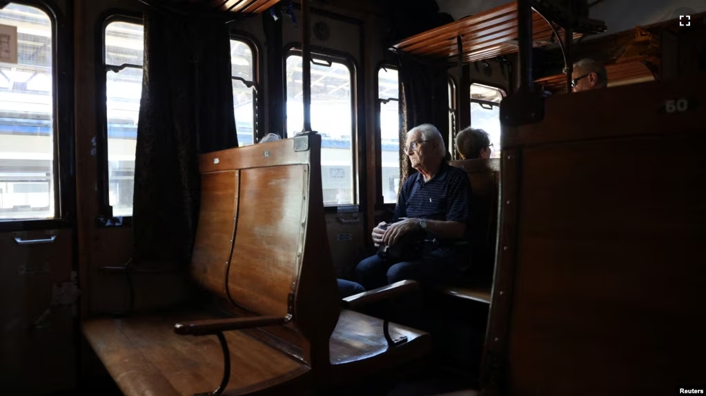 A passenger travels on board of a vintage train that departed from Sulmona on the way to Palena, Italy July 21, 2024. (REUTERS/Antonio Denti)