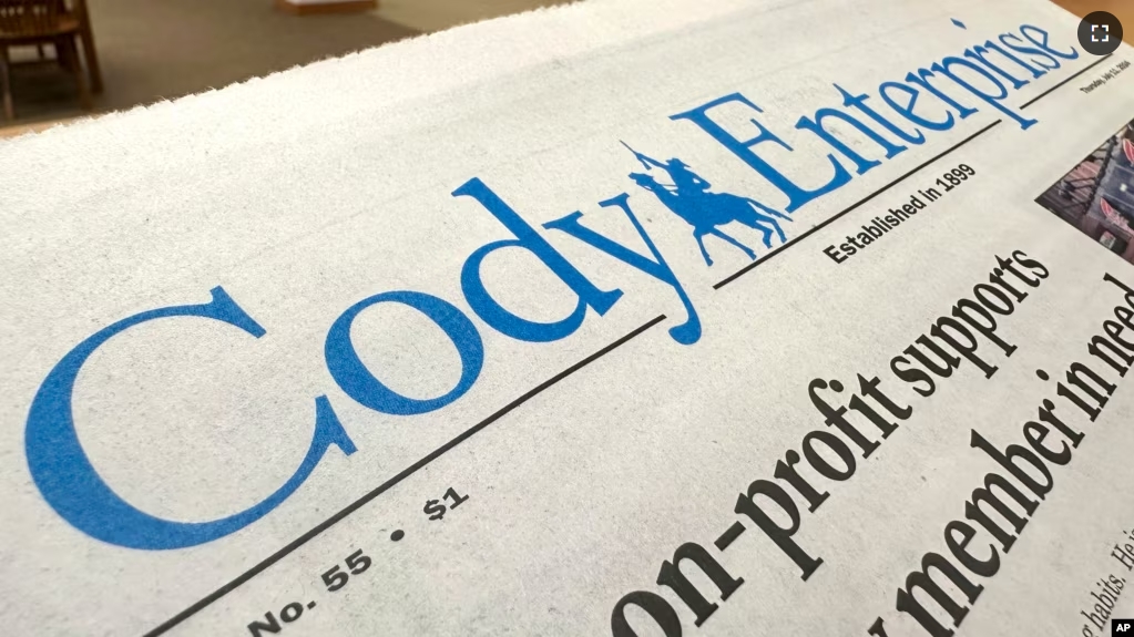 A recent issue of the Cody Enterprise, the Wyoming newspaper where a reporter used artificial intelligence to help write his stories, is seen Tuesday, Aug. 13, 2024, at the Wyoming State Library in Cheyenne. (AP Photo/Mead Gruver)