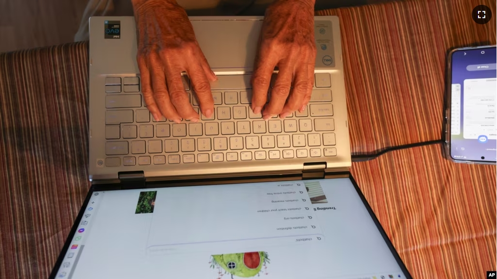 Barbara Winston uses a computer at her home in Northbrook, Ill., on Sunday, June 30, 2024, several days after taking an introduction to artificial intelligence class at a local senior center. (AP Photo/Teresa Crawford)