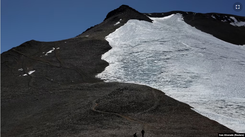 Mountaineers walk past the Iver glacier close to the El Plomo mountain summit, in the Andes mountain range, in the Santiago Metropolitan Region, Chile, April 4, 2024. (REUTERS/Ivan Alvarado)