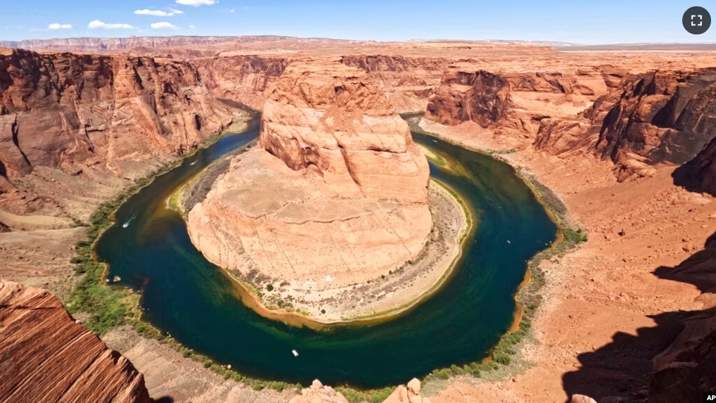 FILE - The Colorado River flows at Horseshoe Bend in the Glen Canyon National Recreation Area, in Page, Arizona, June 8, 2022. (AP Photo/Brittany Peterson, File)