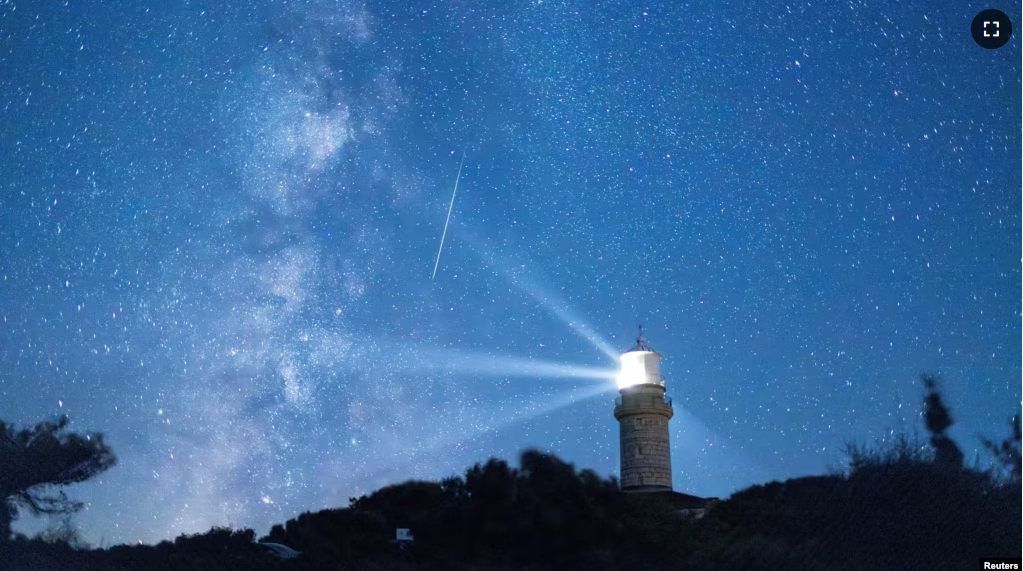 FILE - A meteor streaks in the night sky during the annual Perseid meteor shower on the island of Lastovo, Croatia, Aug. 12, 2023. (REUTERS/Antonio Bronic)