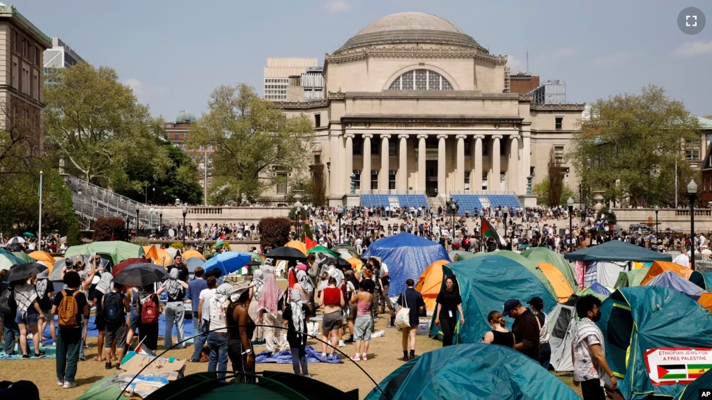 FILE - Student protesters gather inside their encampment on the Columbia University campus, April 29, 2024, in New York. (AP Photo/Stefan Jeremiah, File)