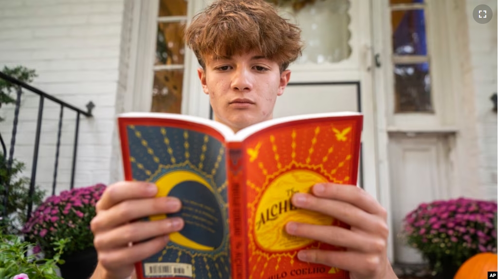 Chris Stanislawski, 14, of Garden City, N.Y., didn't finish any books in his 8th grade English class, in part because their google classroom had detailed summaries of each chapter of every book. (AP Photo/Brittainy Newman)