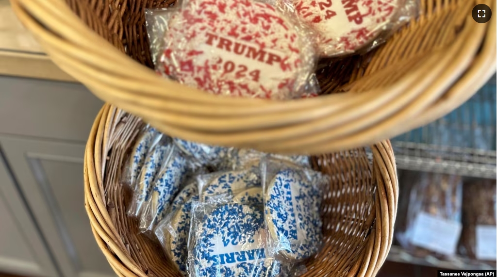 Cookies, with Harris and Trump labels on, are on display at Lochel's Bakery in the town of Hatboro in suburban Philadelphia, Tuesday, Sept. 24, 2024. (AP Photo/Tassanee Vejpongsa)