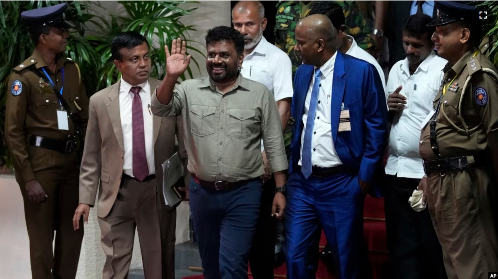 Marxist lawmaker Anura Kumara Dissanayake waves as he departs the election commission office after winning the Sri Lankan presidential election in Colombo, Sri Lanka, Sept. 22, 2024. (AP Photo/Eranga Jayawardena)