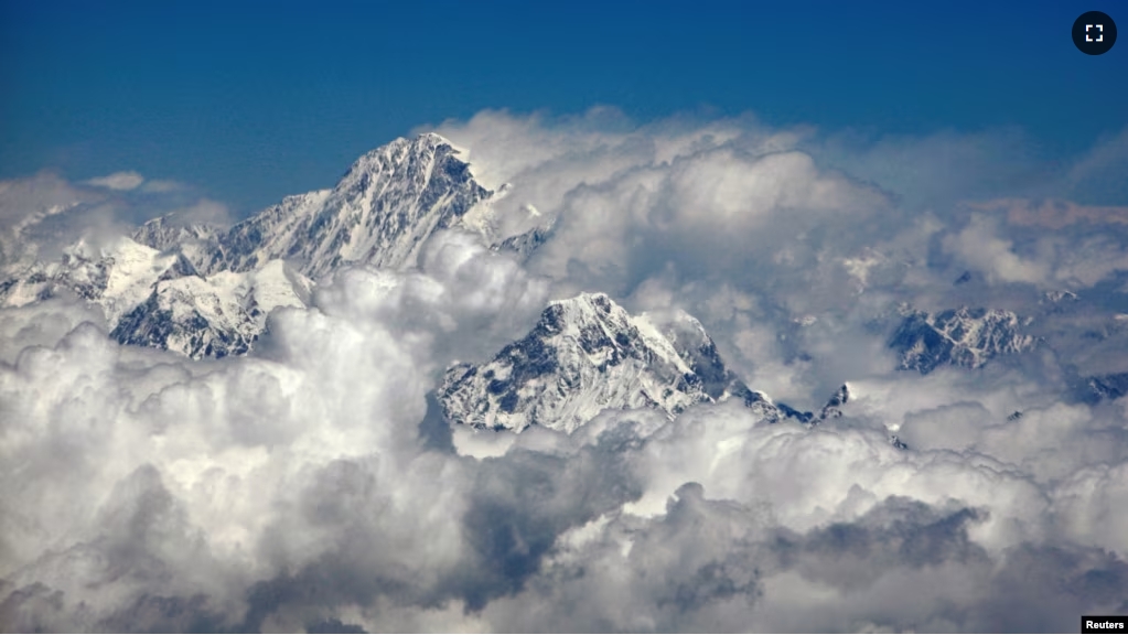 FILE - Mount Everest or Sagarmatha (top), the highest peak in the world with an altitude of 8.848 meters is seen in this aerial view next to Mount Ama Dablam (bottom R) on April 22, 2007. (REUTERS/ Desmond Boylan/File Photo)