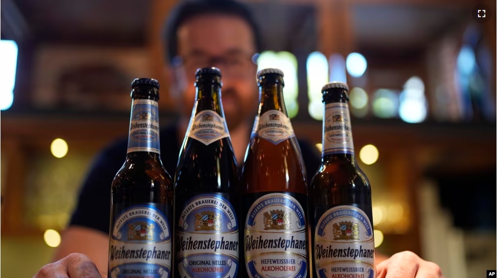 FILE - Head Brewmaster Tobias Zollo poses behind non alcoholic beer at the Weihenstephan brewery in Freising, Germany, Friday, Sept. 20, 2024. (AP Photo/Matthias Schrader)