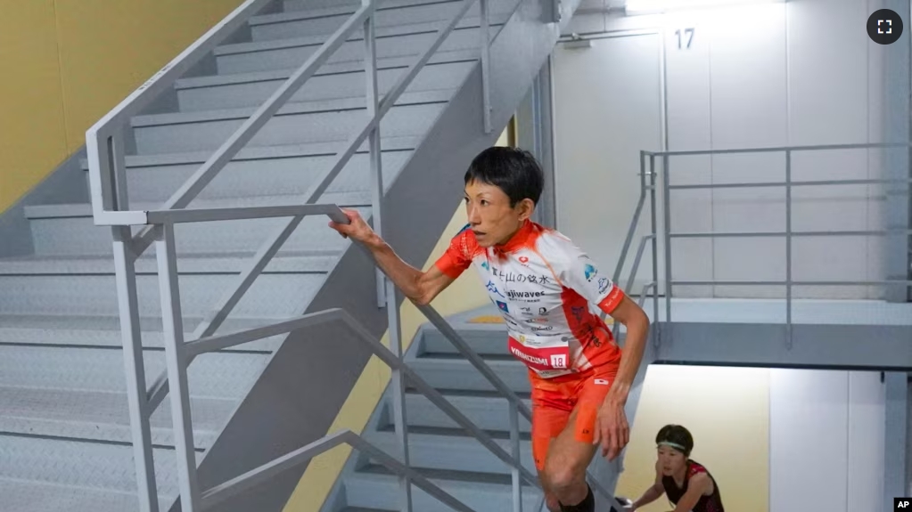 FILE - In this photo provided by ISF/Meeting, runner Yuri Yoshizumi competes during a race of Stairclimbing World Championships in Osaka, western Japan, on Nov. 19, 2023. (ISF/MEETING via AP)