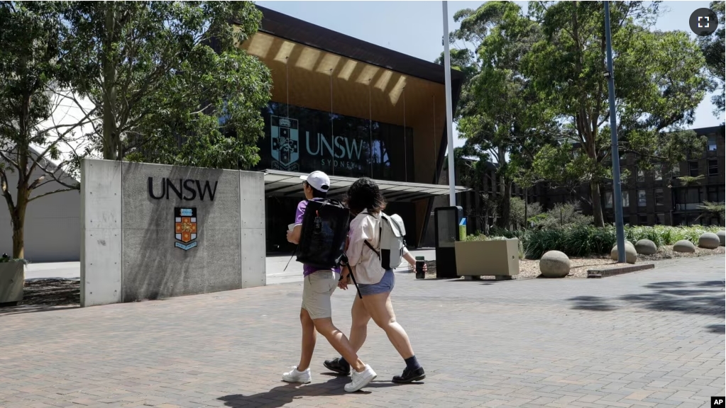 FILE - In this Dec 1, 2020, file photo, students walk around the University of New South Wales campus in Sydney, Australia. (AP Photo/Mark Baker, File)