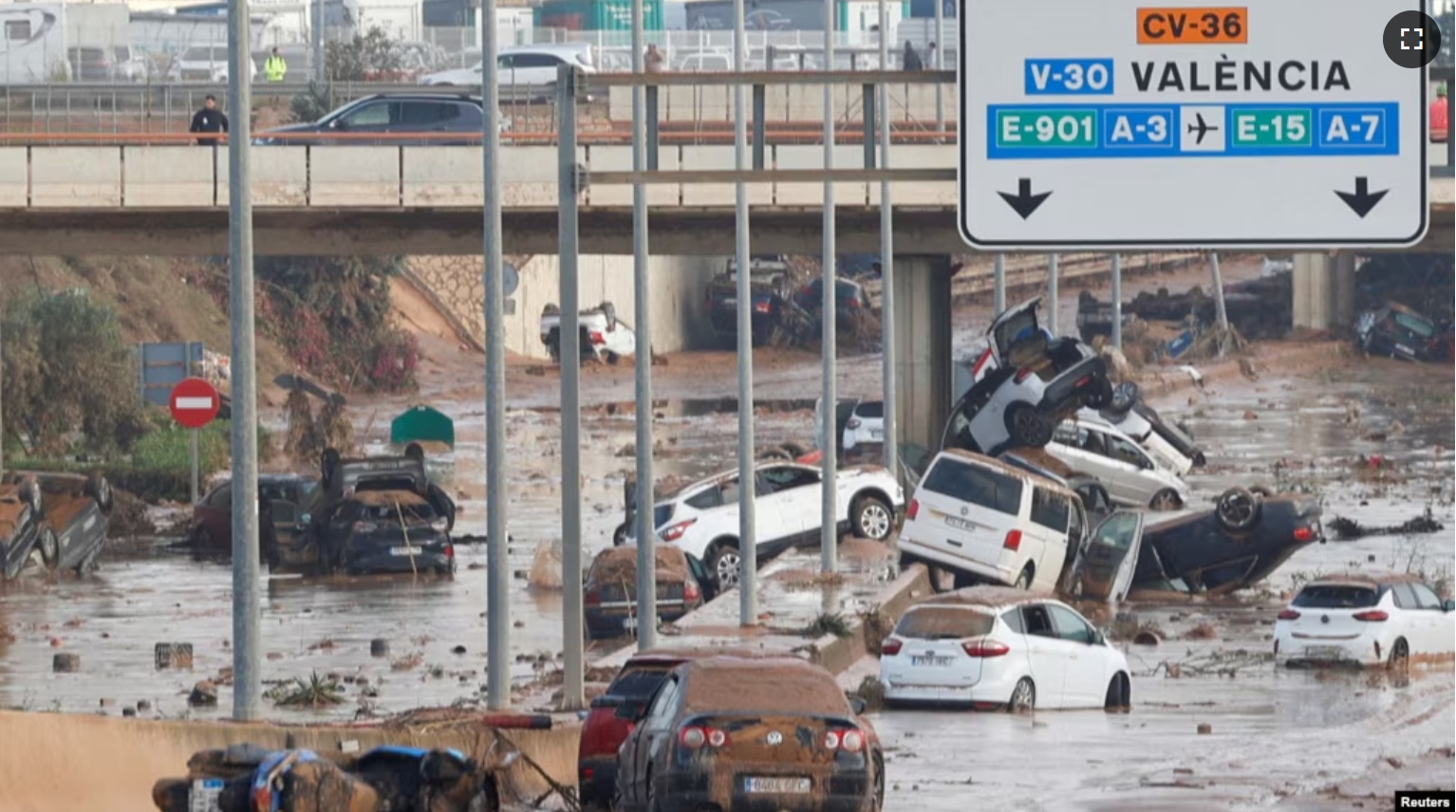 Damaged cars are seen along a road affected by torrential rains that caused flooding, on the outskirts of Valencia, Spain, October 31, 2024. (REUTERS/Eva Manez)