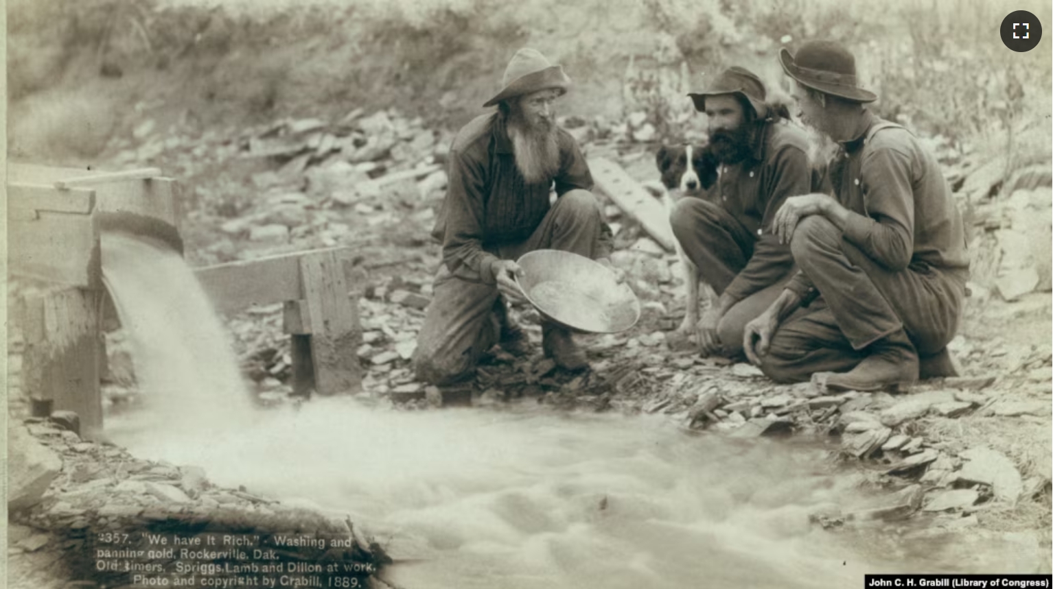 FILE - "Old timers, Spriggs, Lamb and Dillon at work" panning for gold (pay dirt) at Rockervill, S.D., in the Black Hills, 1889. (John C. H. Grabill/Library of Congress)