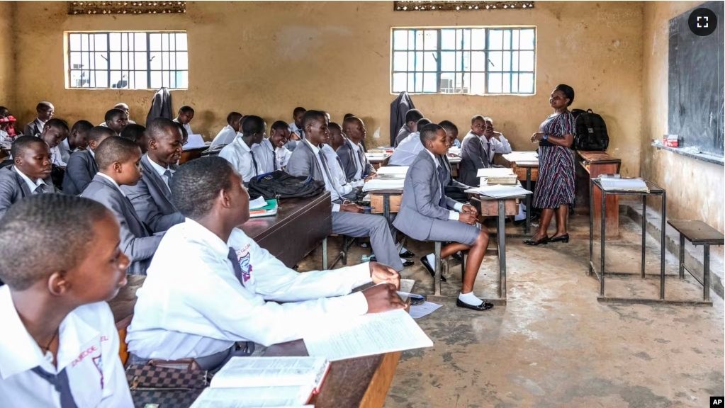 A teacher gives a lesson to his students at Wampewo Ntakke Secondary School in Kawempe tula village, Kampala, Uganda on Nov. 4, 2024. (AP Photo/Hajarah Nalwadda)