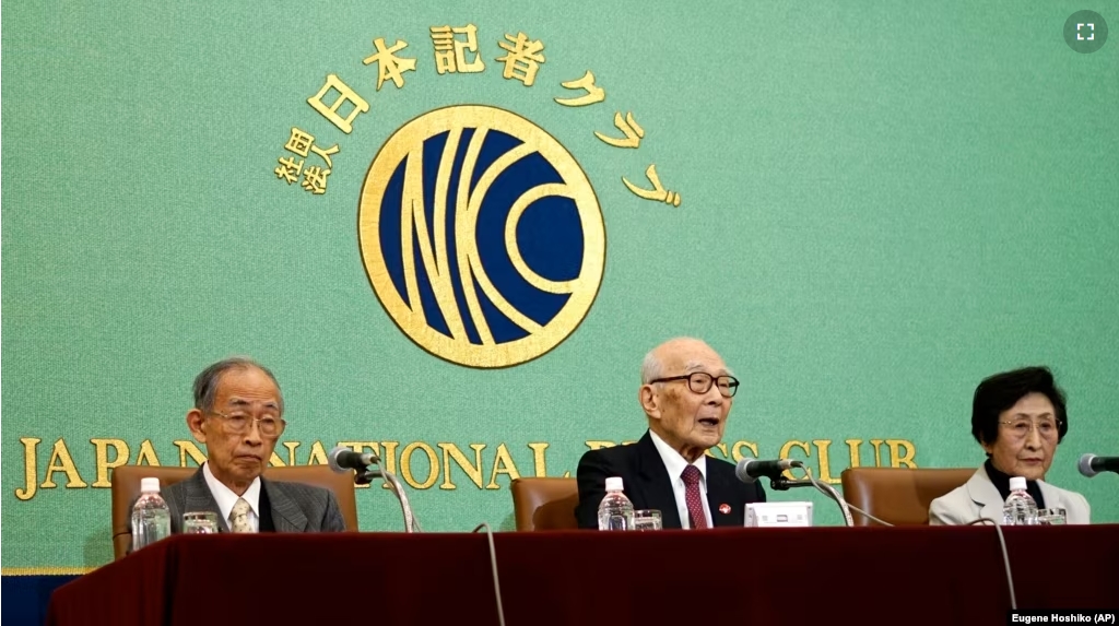 From left, Jiro Hamasumi, Terumi Tanaka and Michiko Kodama, members of the Japan Confederation of A- and H-Bomb Sufferers Organizations, attend a press conference at Japan National Press Club Tuesday, Dec. 24, 2024, in Tokyo. (AP Photo/Eugene Hoshiko)