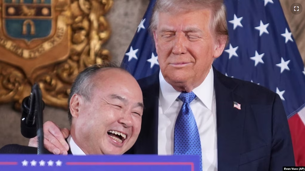 SoftBank Group CEO Masayoshi Son smiles with President-elect Donald Trump during a news conference at Mar-a-Lago, Monday, Dec. 16, 2024, in Palm Beach, Florida. (AP Photo/Evan Vucci)