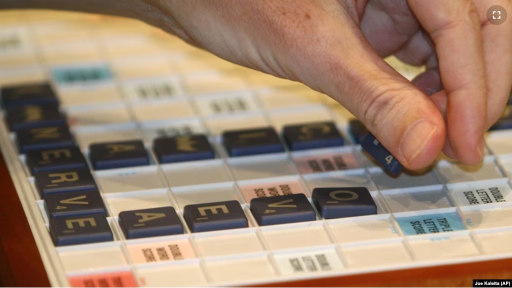 FILE - National SCRABBLE Champion Nigel Richards spells F-O-V-E-A-E (a part of the eye) in the final game of the competition at the Royal Pacific Resort in Orlando, Florida, on July 29, 2008. (Joe Kaleita/AP Images/SCRABBLE)