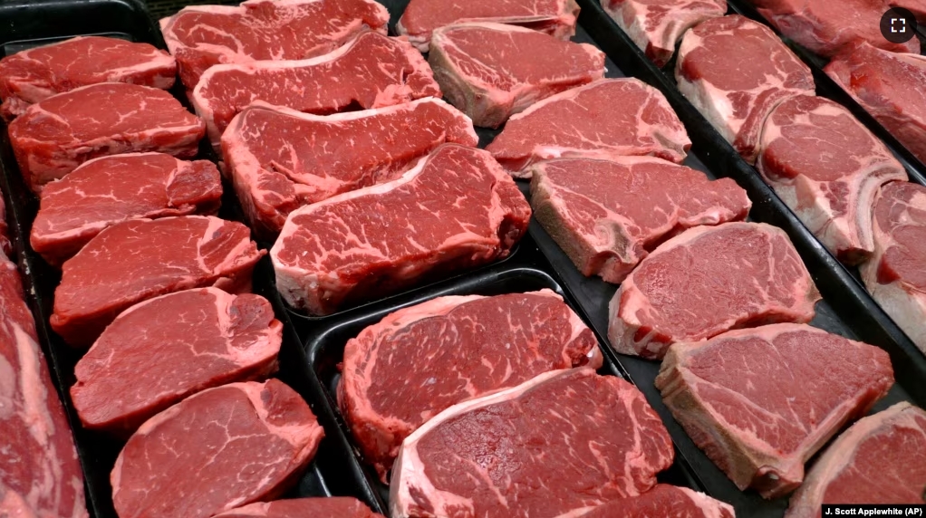 FILE - New U.S. food guidelines suggest eating less red meat and more beans, vegetables and healthy fats. In this Jan. 18, 2010 file photo, beef products are for sale at a food store in McLean, Virginia. (AP Photo/J. Scott Applewhite)