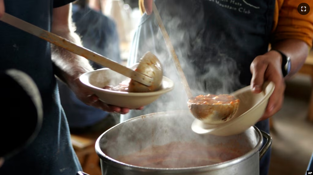 FILE - Tomato vegetable soup is served at Madison Spring Hut in the White Mountains of New Hampshire, Monday, June 11, 2007. (AP Photo/Robert F. Bukaty, File)