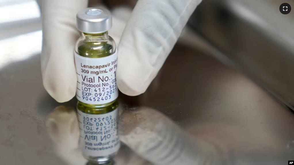 In this file image, a pharmacist holds a vial of lenacapavir, the new HIV prevention injectable drug, at a health research center in Cape Town, South Africa, Tuesday, July 23, 2024. (AP Photo/Nardus Engelbrecht, File)