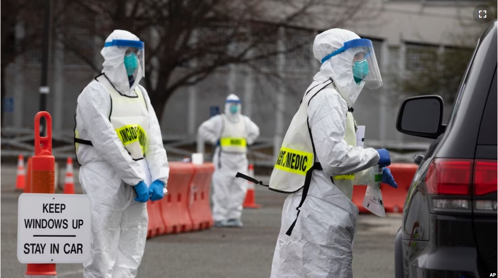 During the coronavirus pandemic, many resources were spread very thin. Pictured here, medical workers screen people arriving at a special COVID-19 testing site in Boston, Saturday, March 28, 2020. (AP Photo/Michael Dwyer)